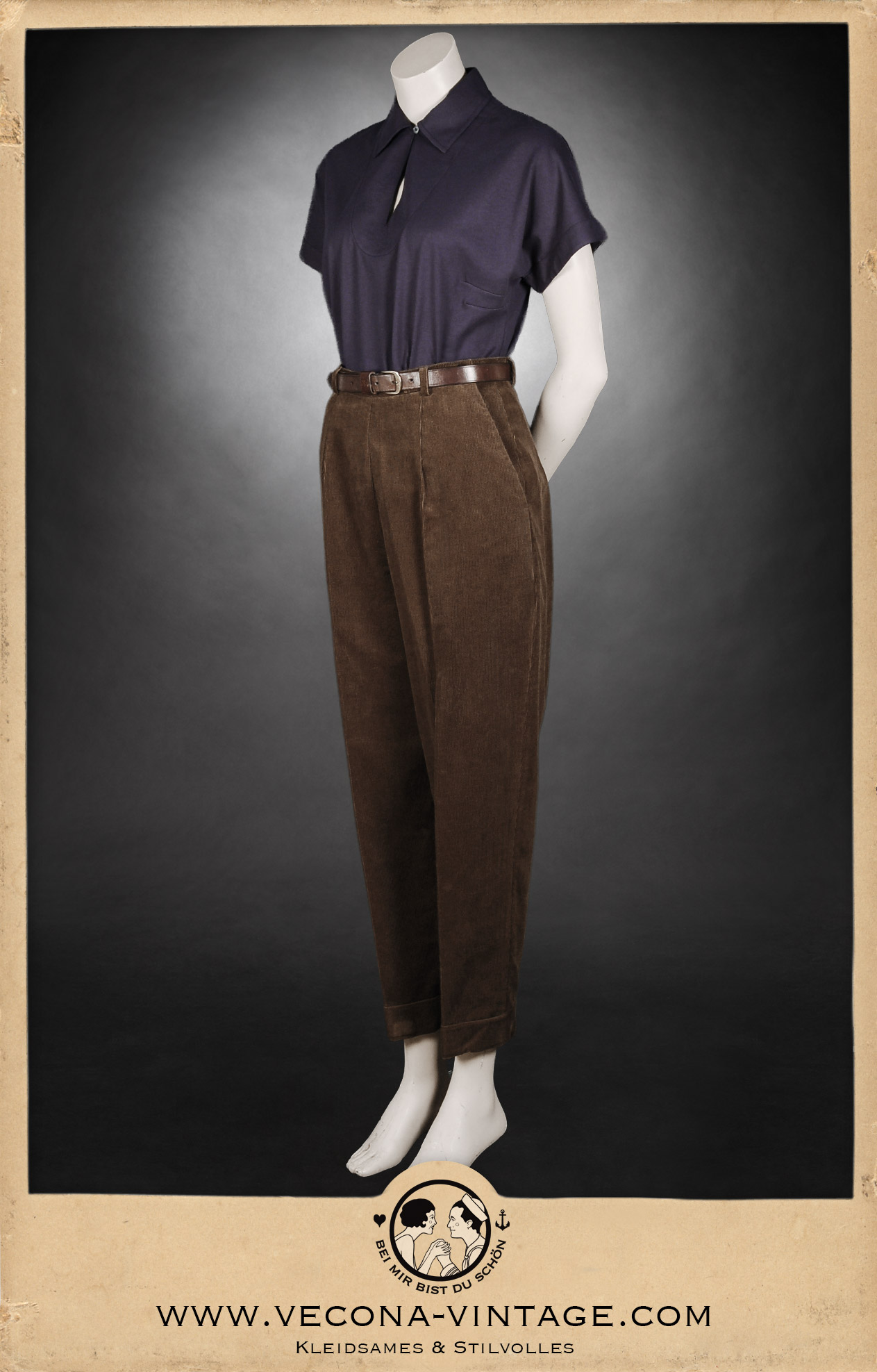 1940s vintage women's outfit consisting high waisted and tapered corduroy trousers and a navy blue polo shirt, all made from 100% cotton