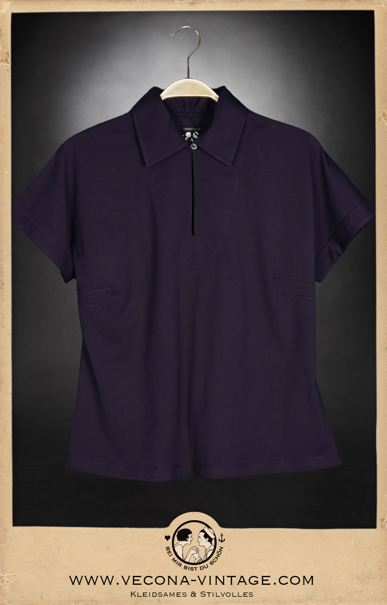 1920s-40s womens jersey shirt in navy blue with polo collar, shell button and kimono sleeves. Great for casual summer outfits and vintage sport looks. View on a hanger.