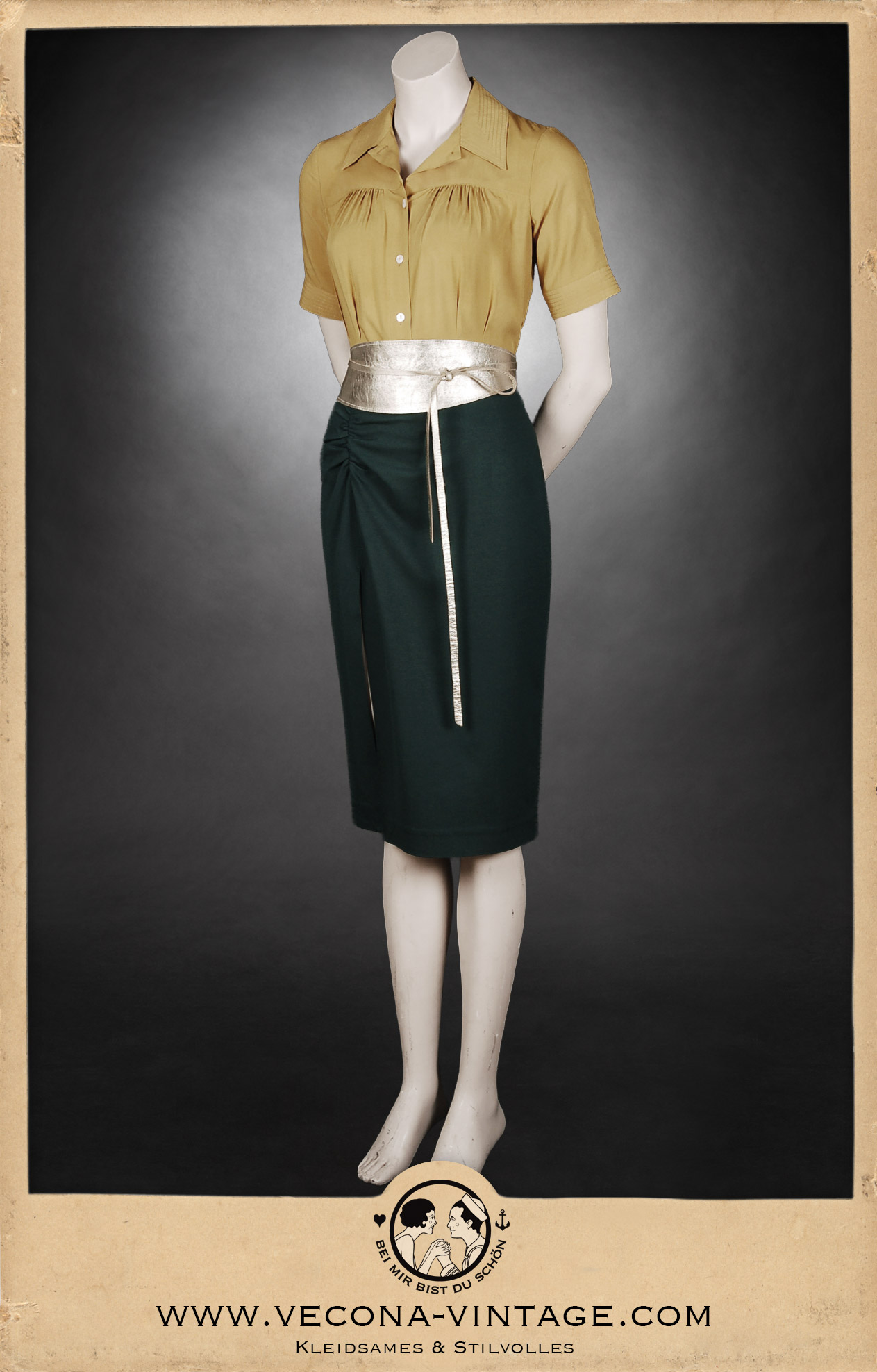 Front view of the 1930s blouse Greta in mustard yellow with the 1940s high waist pencil skirt Apache in dark green paired with a gold kimono waist belt for a vintage party look.