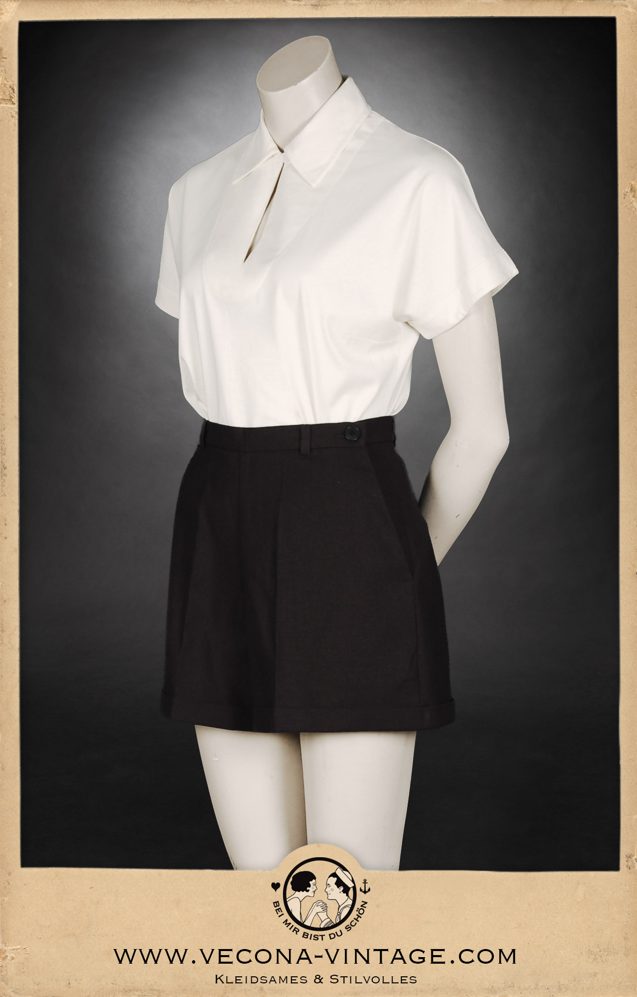 1930s vintage women's outfit consisting high waisted shorts in black and a cream white polo shirt, great for summer vacation and vintage sports. Side view.